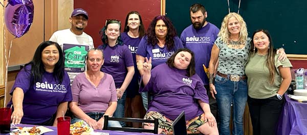 Yuba IHSS workers wearing purple and smiling